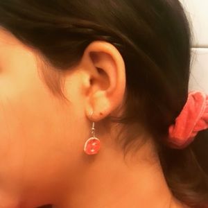 Red clay circle earrings that are handmade.
